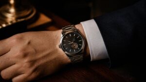 Close-up of a steel automatic watch on a man's wrist